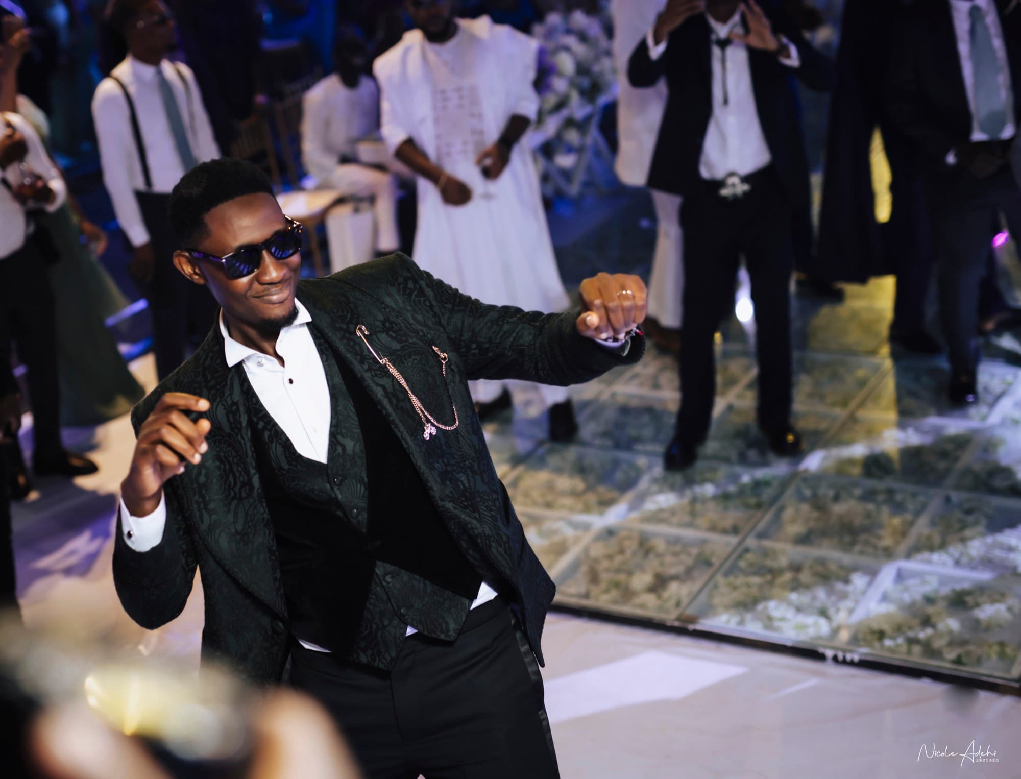 Lanre dances at the white-wedding reception.