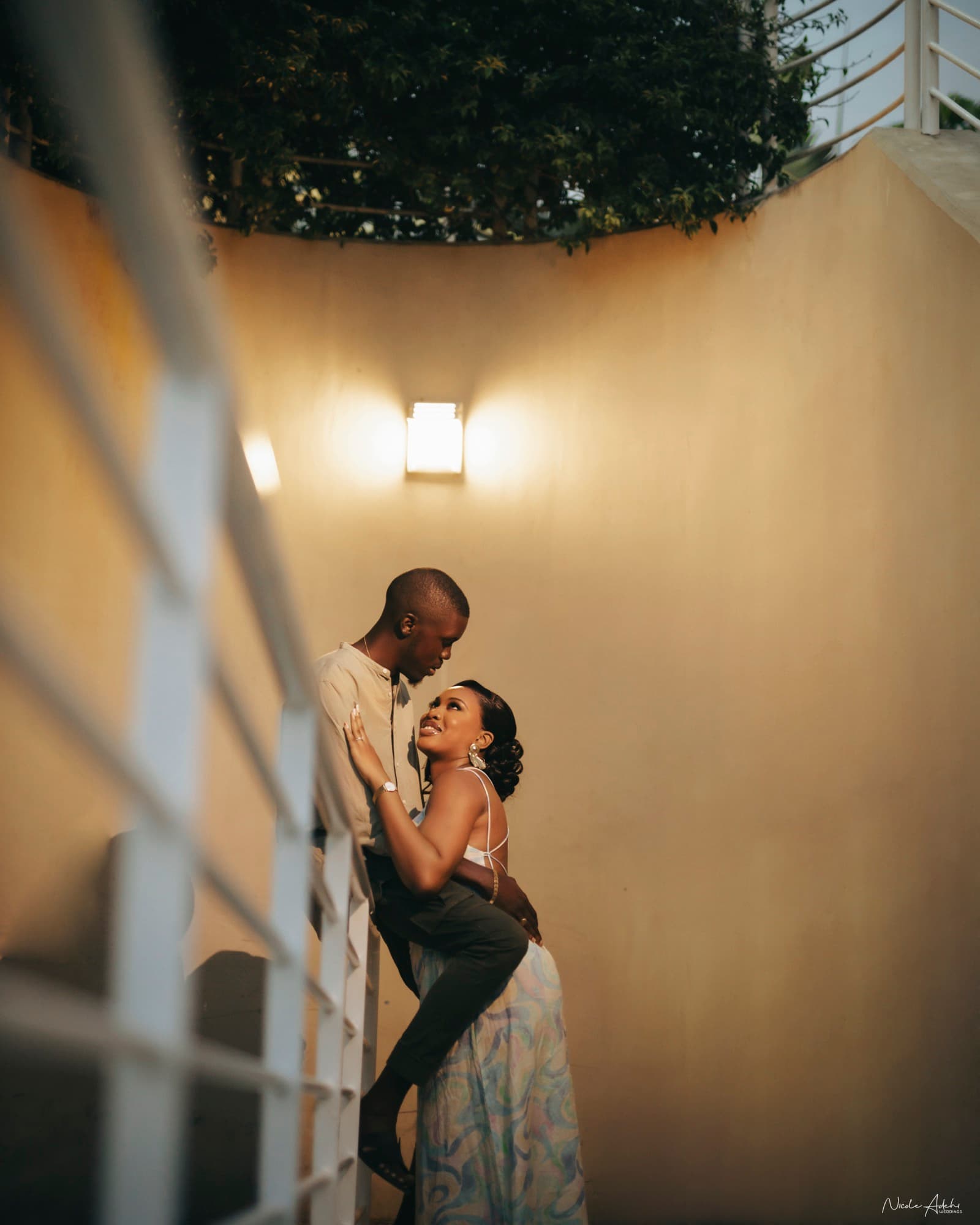 Ore and Esi together in a tender post-wedding portrait.