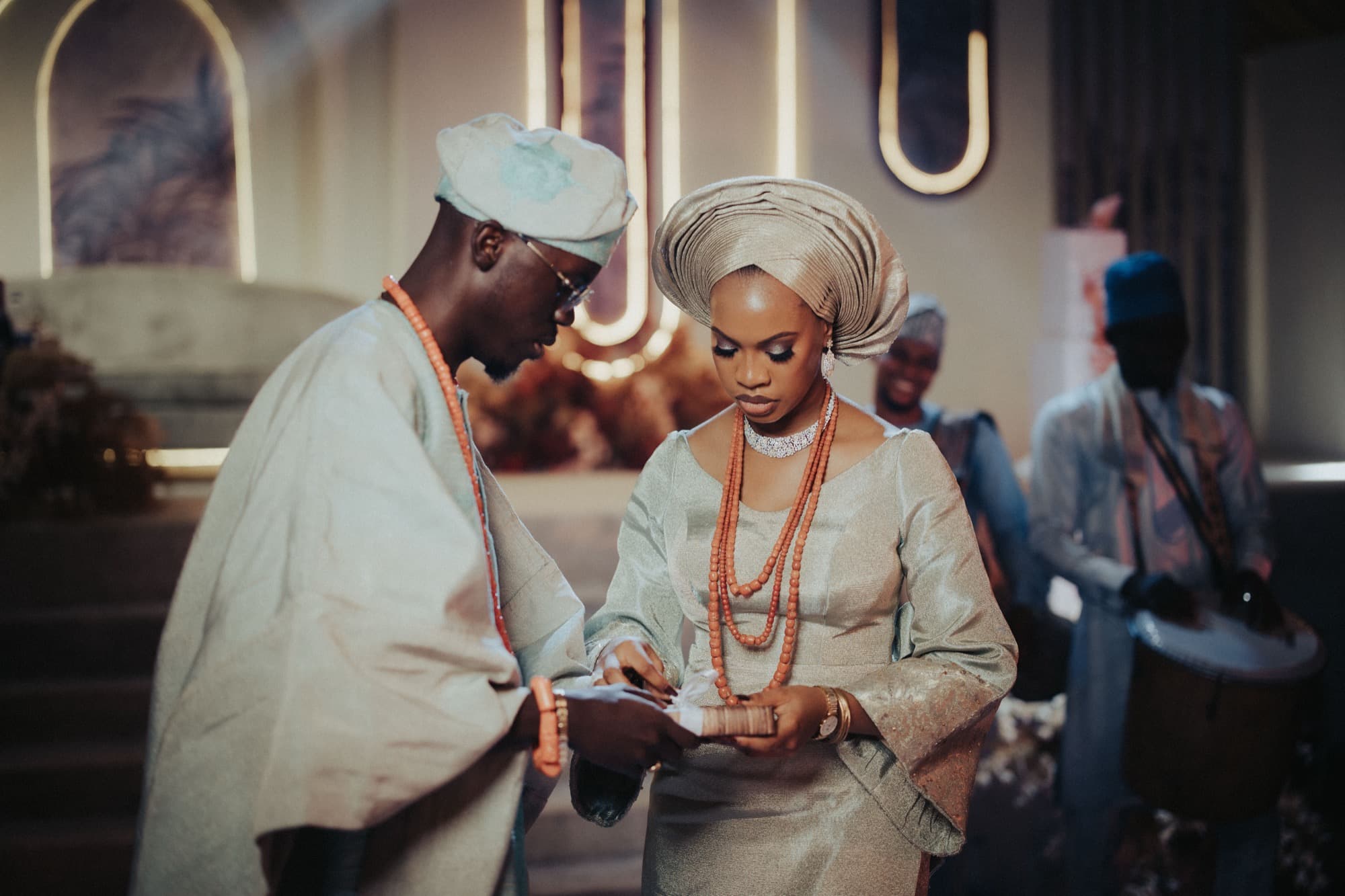 Ore and Esi at the traditional ceremony as the drummers play.