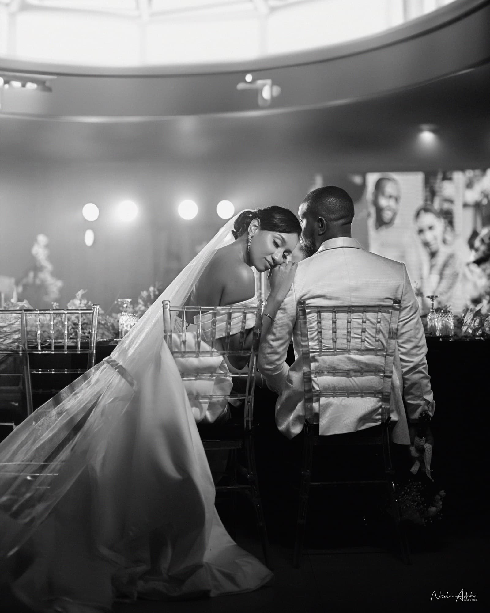 Sofia and Damiete share a quiet moment at the white-wedding reception.