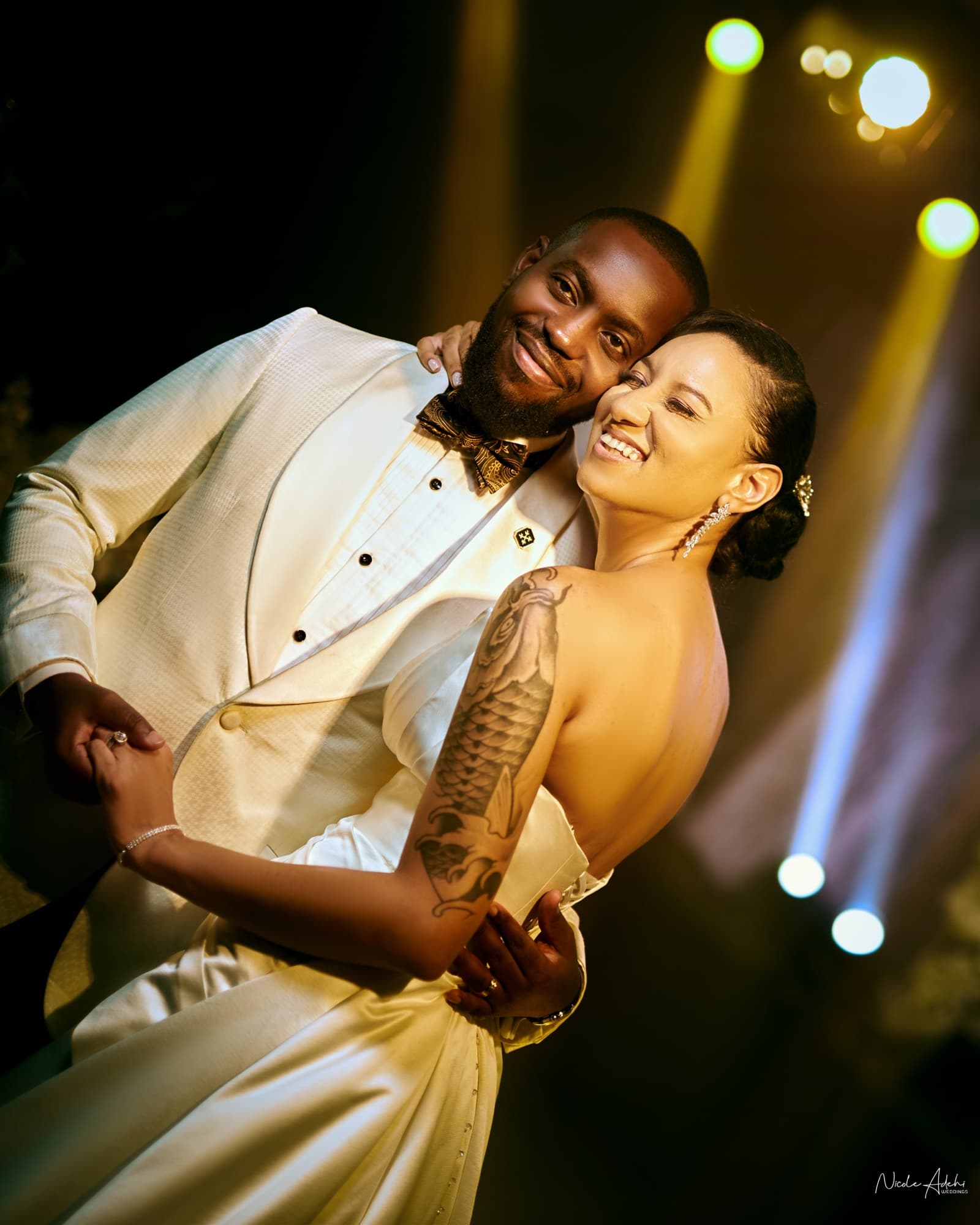 A tender moment at Sofia and Damiete's white wedding.